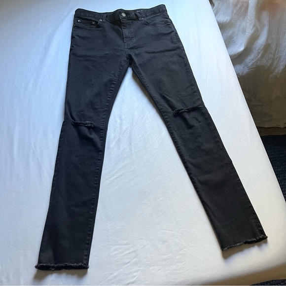 SAINT LAURENT PARIS black denim distressed cropped raw hem skinny jeans